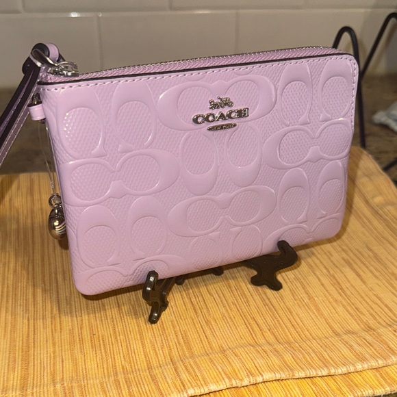 Coach Handbags - NWT Coach Light Purple Embossed Wristlet